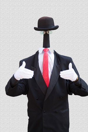The picture shows a suited man without a head.の写真素材