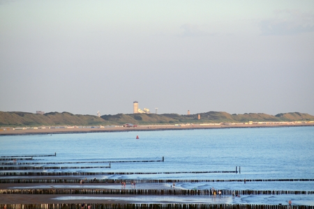Blue North Sea with tower in the backgroundの写真素材