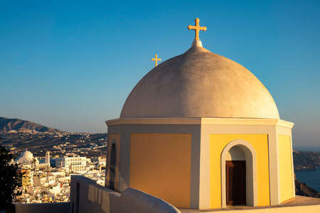 Panoramic view of seashore with old greek church in Santorini island, Greeceの写真素材