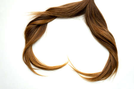 Heart made of natural hair on white background Healthy hair concept - heart shaped hairの写真素材