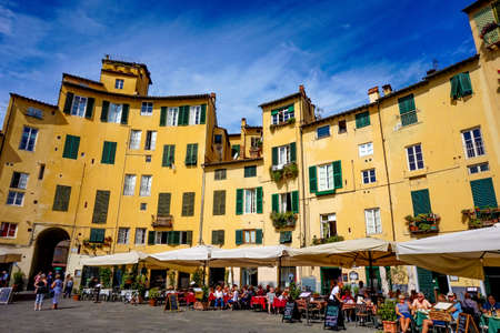 Lucca, Tuscany / Italy - 09.15.2017: People having lunch in the restaurants of the amphitheatre square with really nice historical atmosphereのeditorial素材