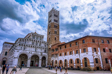 Lucca, Tuscany Italy - 09.15.2017: st martin chatedral with cloudy blue sky and peopleのeditorial素材