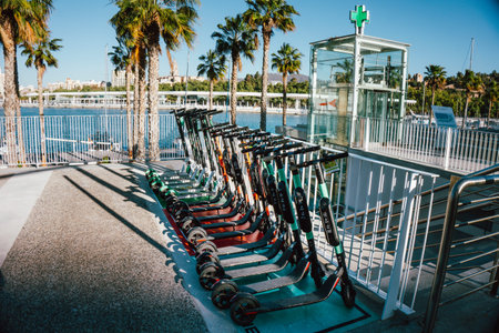 Spain, Malaga - 04.04.2019: electric scooters rollers parked on the sidewalk in the city center of...