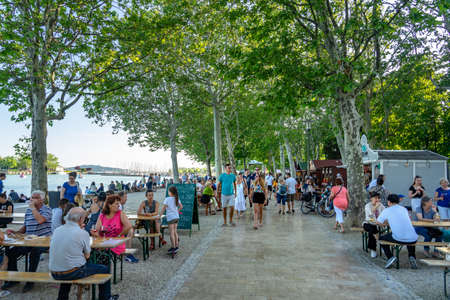 Balatonfured, Hungary, 06.10.2019 : Fish ad wine festival at lake balaton with people and lake background summerのeditorial素材