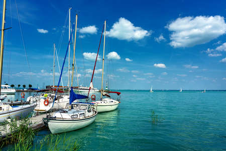 sail boats on the blue lake Balaton in Tihany Hungaryの写真素材