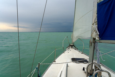 Sailboat on the lake Balaton ship prow view .