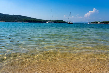 Crystal clear turquoise water in Cres Island Croatiaの写真素材