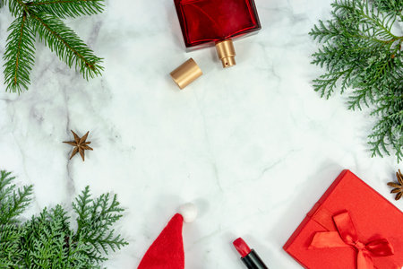 Christmas frame background flat lay on marbel with decoration gift box perfume and lipstick .の写真素材