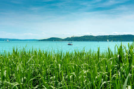 boat on the lake Balaton view of Tihany church from Balatonfuredの写真素材