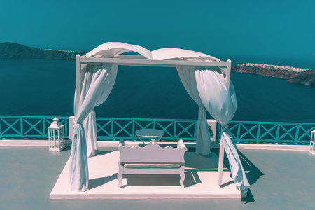 Romantic wedding arch decoration in Santorini Geece over the sea .