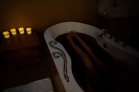 wine bath in Villany Hungary with vintage water tap and legs of a woman .の写真素材