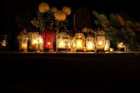 rememberance candle lanterns in the cemetery on all saints day .の写真素材