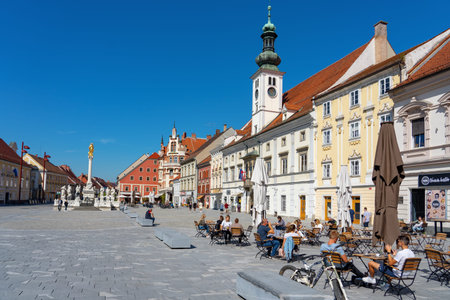 09.06.2021: Maribor, Szlovenia: Famous main square Glavni trg of Maribor the second largest city in Slovenia with people and resaturantのeditorial素材