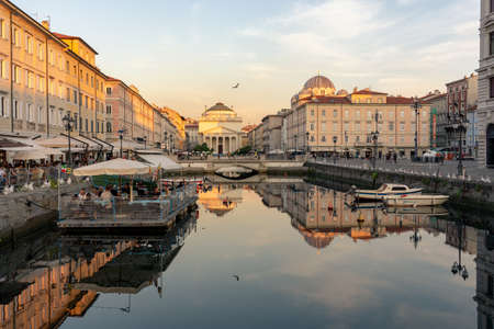 11.08.2021: Trieste, Italy: Canal Grande di Trieste with beautiful buildings and refletion on the waterのeditorial素材