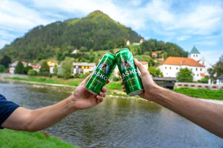 09.15.2021: Lasko, Slovenia: Cheers Toast with Lasko canned beer in Lasko Sloveniaのeditorial素材