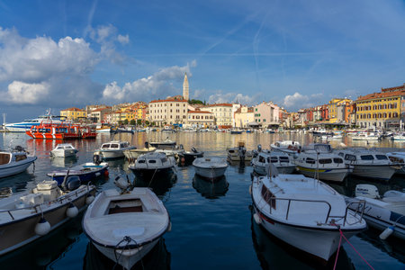 boats in the harbor with Rovinj with the adriatic sea backgroundの写真素材