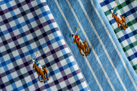 3 colorful close up stitched logo on shirts