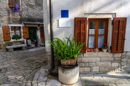 charming little village in Croatia called the istrian Toscana with stone walls and nice doors and windowsの写真素材