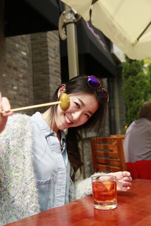 Girl having her afternoon tea in a cafeの写真素材