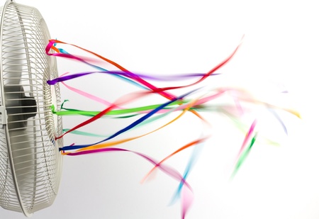 Bright colorful silk ribbons on an electric fanの写真素材