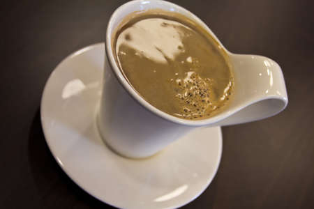 A cup of fresh white coffeeの写真素材