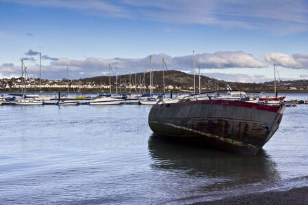 A fishing boat layed up in the sunのeditorial素材