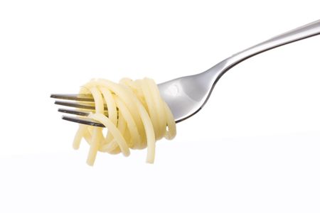 spaghetti on a fork over white backgroundの写真素材