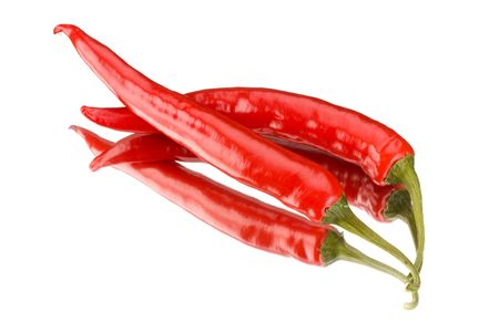 two red peppers on a mirror isolated on a white backgroundの写真素材