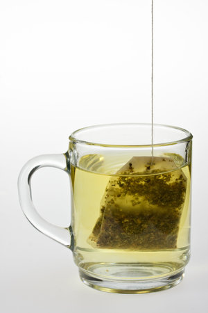 glass of herbal tea isolated on whiteの写真素材