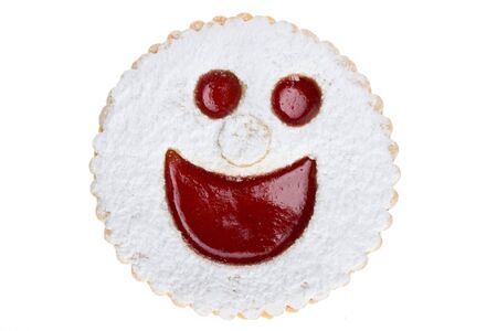 smiling cookie isolated on white backgriundの写真素材
