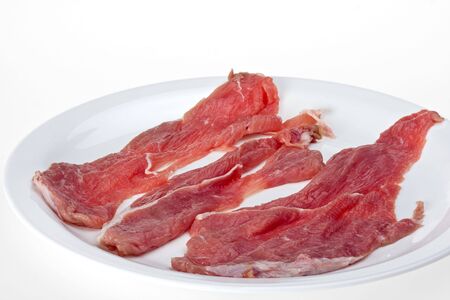 raw  veal  escalope  isolated on white backgroundの写真素材