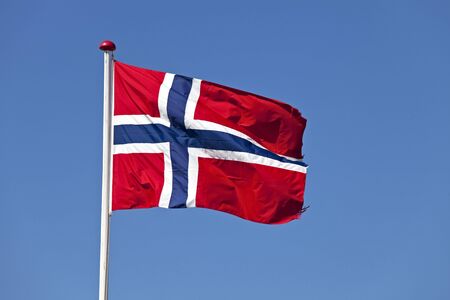 norwegian flag in the wind outdoorsの写真素材