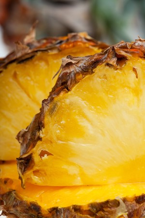 slices of a ripe pineapple isolated on white backgroundの写真素材