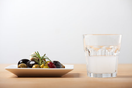 closeup of mixed antipasti with ouzo