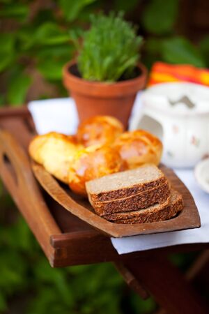 slices of bread on a wooden plateの写真素材