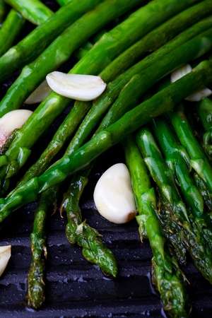 grilled green asparagus and garlicの写真素材
