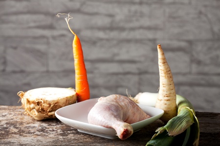 raw chicken leg and vegetables の写真素材
