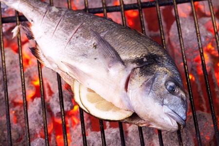 bream on a charcoal grillの写真素材