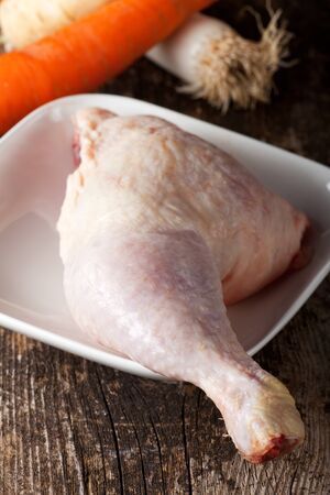 raw chicken leg and vegetablesの写真素材