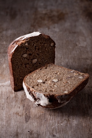 single walnut bread on a wooden plank の写真素材
