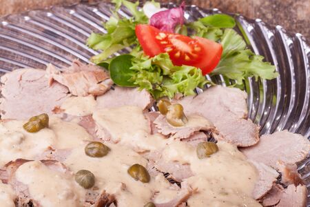 italian vitello tonnato on a glass plate の写真素材