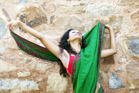 young indian woman in a saree outdoors 