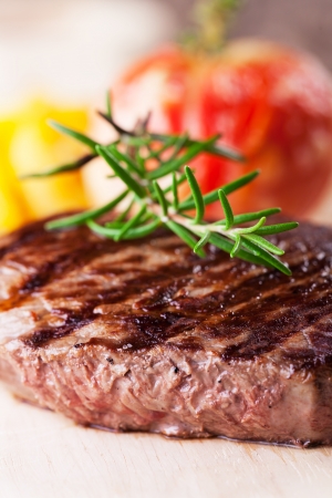 grilled steak with fries and tomato の写真素材
