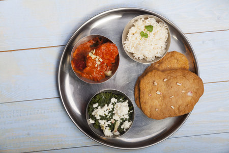 mixed indian thali food with rice 