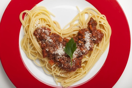 heart shaped spaghetti on a plate の写真素材