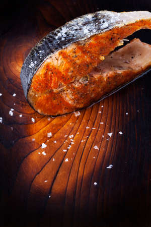 grilled salmon steak on wood の写真素材