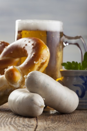bavarian white sausages with bretzel and beer の写真素材