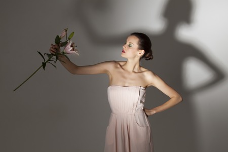 woman with a lily flower の写真素材