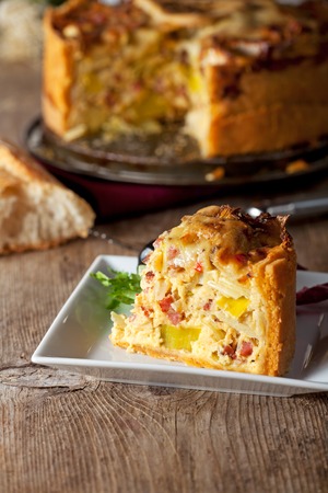 fresh quiche lorraine on a wooden board の写真素材