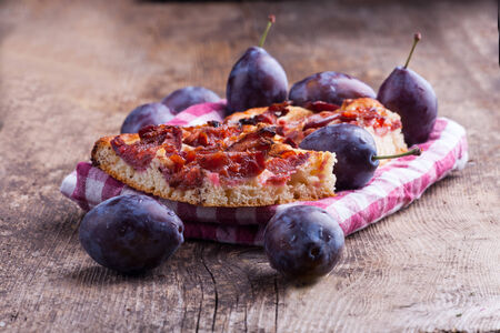 bavarian plum cake on wood の写真素材